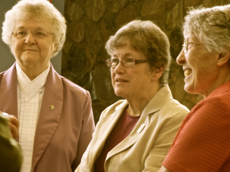 Sisters speak with guests after Mass